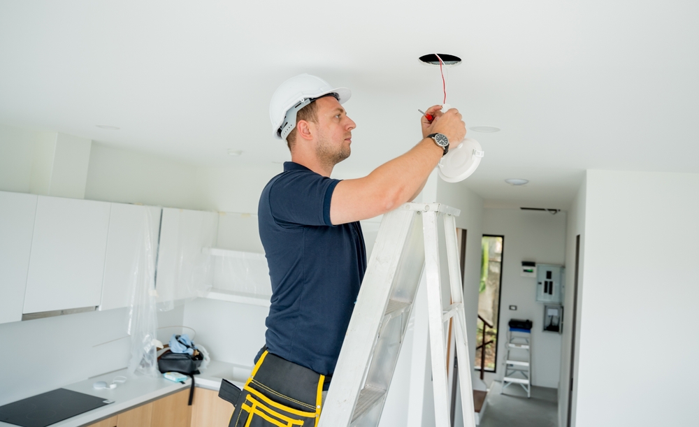 Technician,Is,Installing,An,Led,Spotlight,In,The,Ceiling.